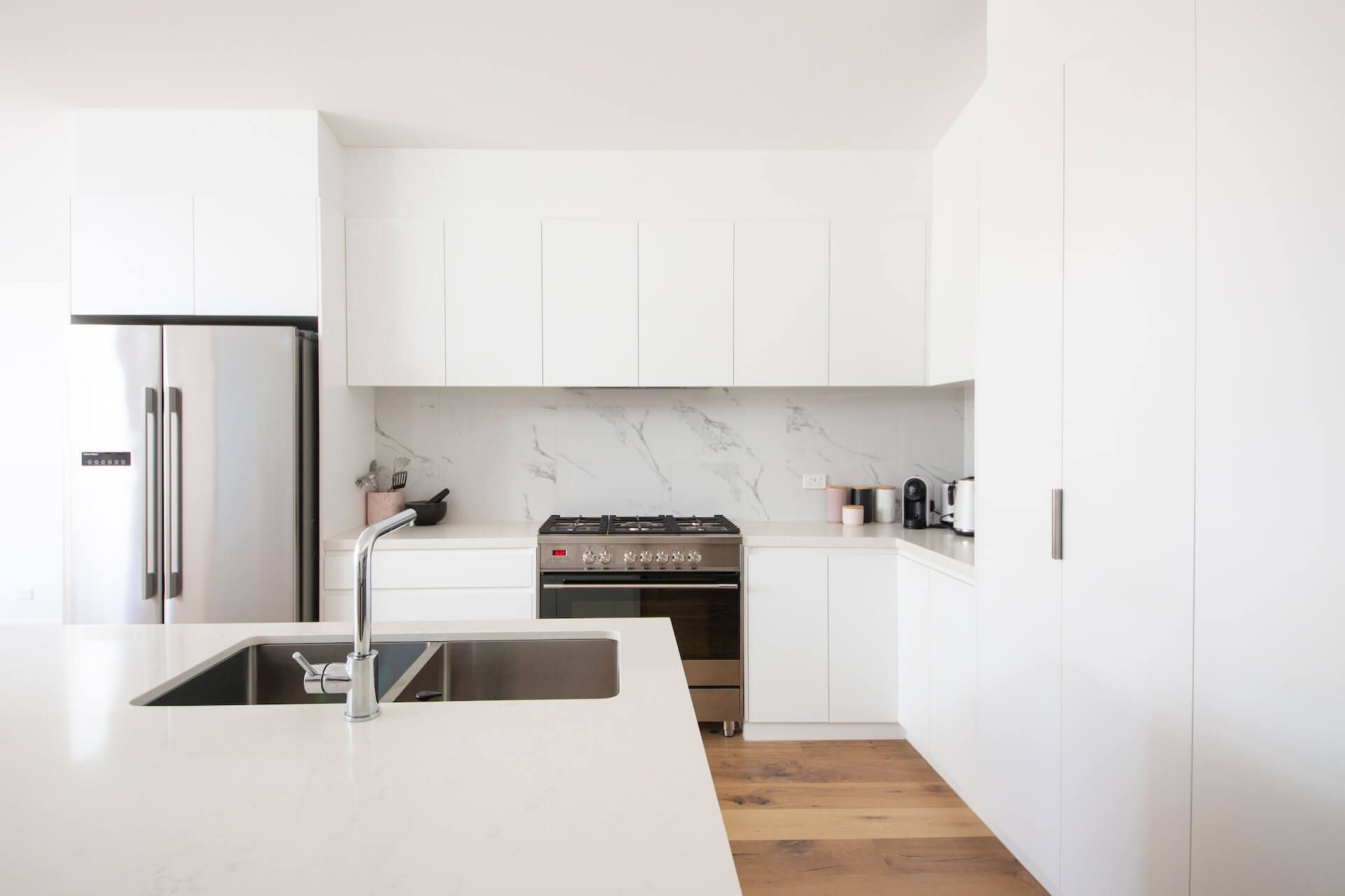 White kitchens without a splash of color feel bland and outdated