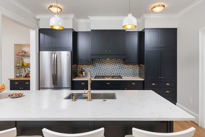 Pairing contrasting color tones, like black and white, can make your kitchen pop.