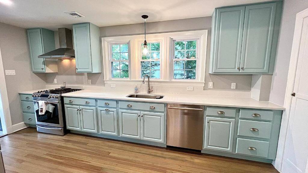 Refinished seafoam green beach kitchen cabinets done by Oceanside Painting & Refinishing in New Jersey