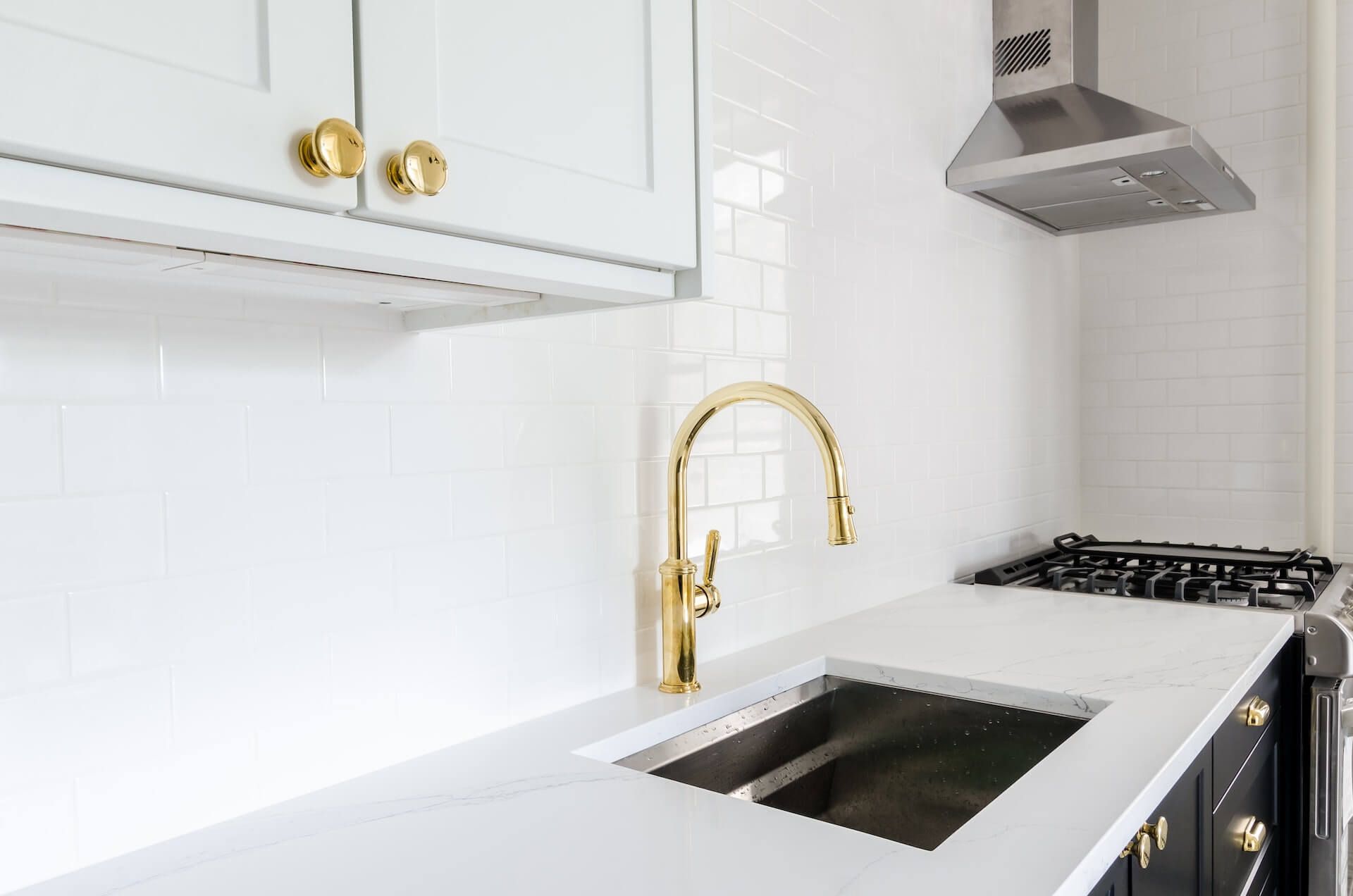 Gold kitchen cabinet hardware and gold faucet