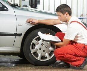Mechanic Inspecting Car Mechanic Inspecting Car