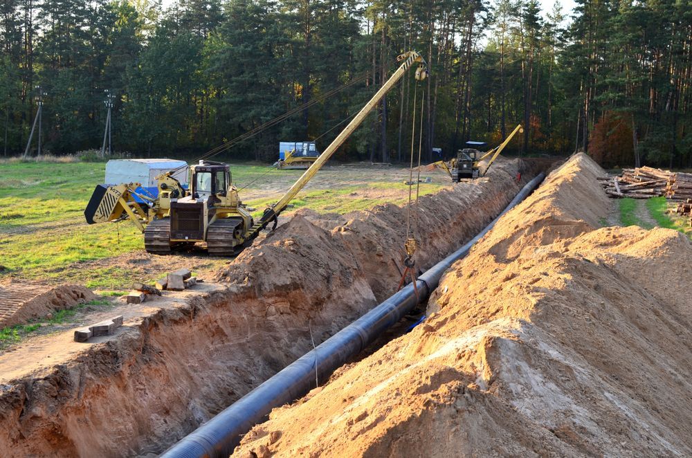 A Bulldozer Is Digging A Trench For A Pipe — Blackpoly Pipelines in Orange, NSW