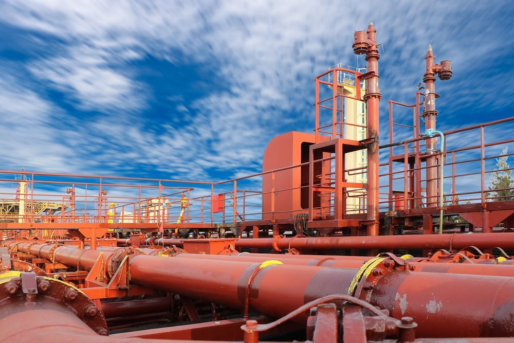 Red Pipes Are Neatly Arranged In A Row — Blackpoly Pipelines in Young, NSW