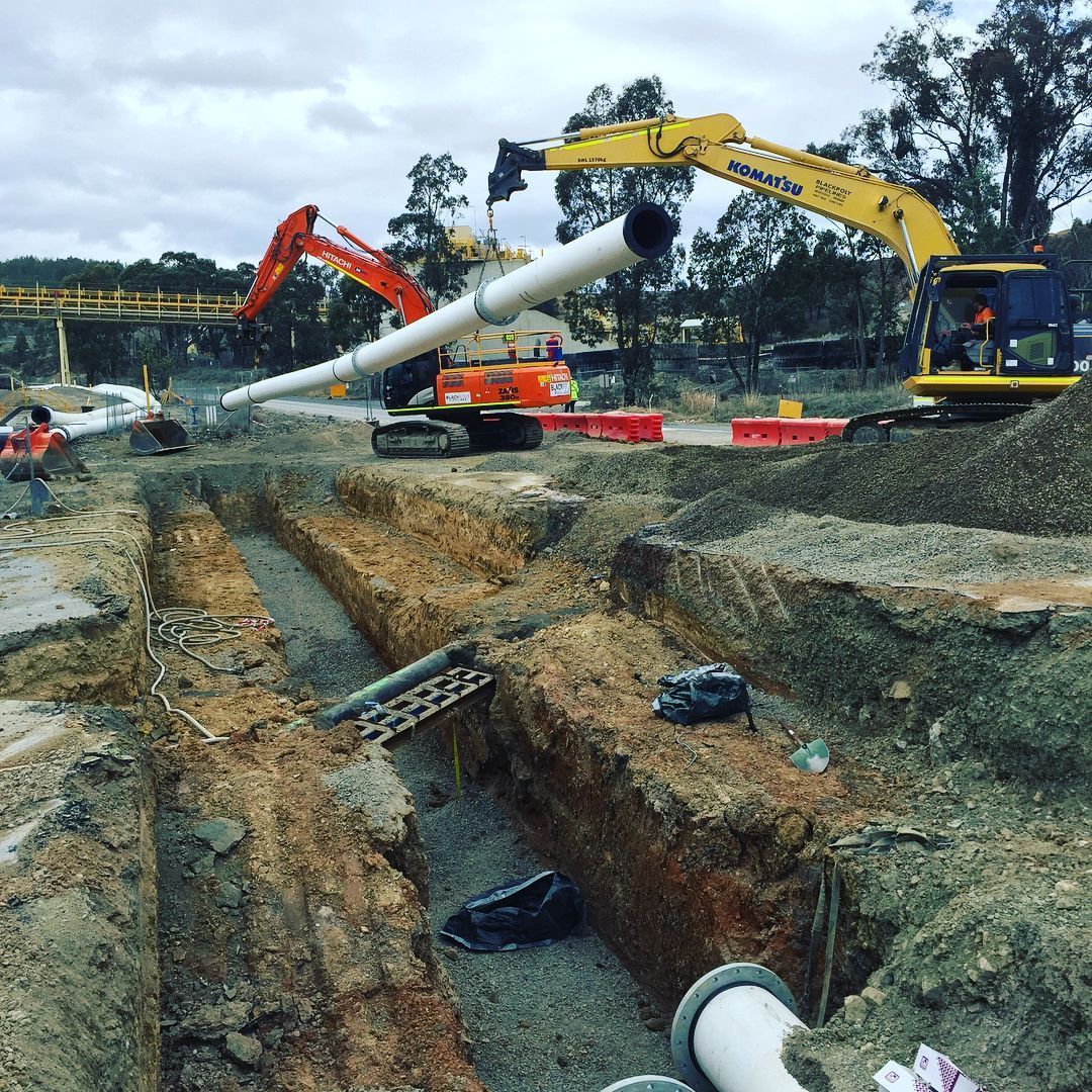 A Construction Site With A Lot Of Machinery And Pipes — Blackpoly Pipelines in Orange, NSW