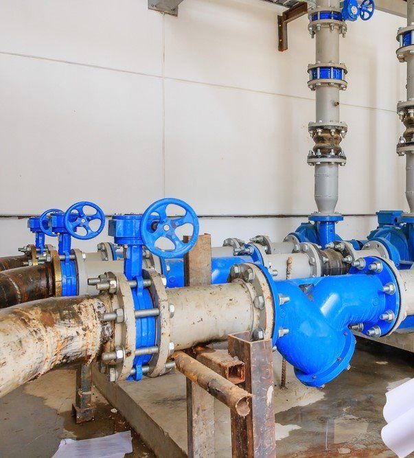 A Collection Of Blue Pipes And Valves Installed In A Room — Blackpoly Pipelines in Gilgandra, NSW