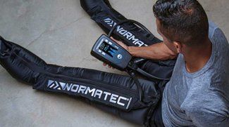 A Man Using NormaTec Pro Machine — Solon, OH — Core Elite Wellness Fit Cryo LLC