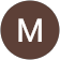 The letter m is in a brown circle on a white background.