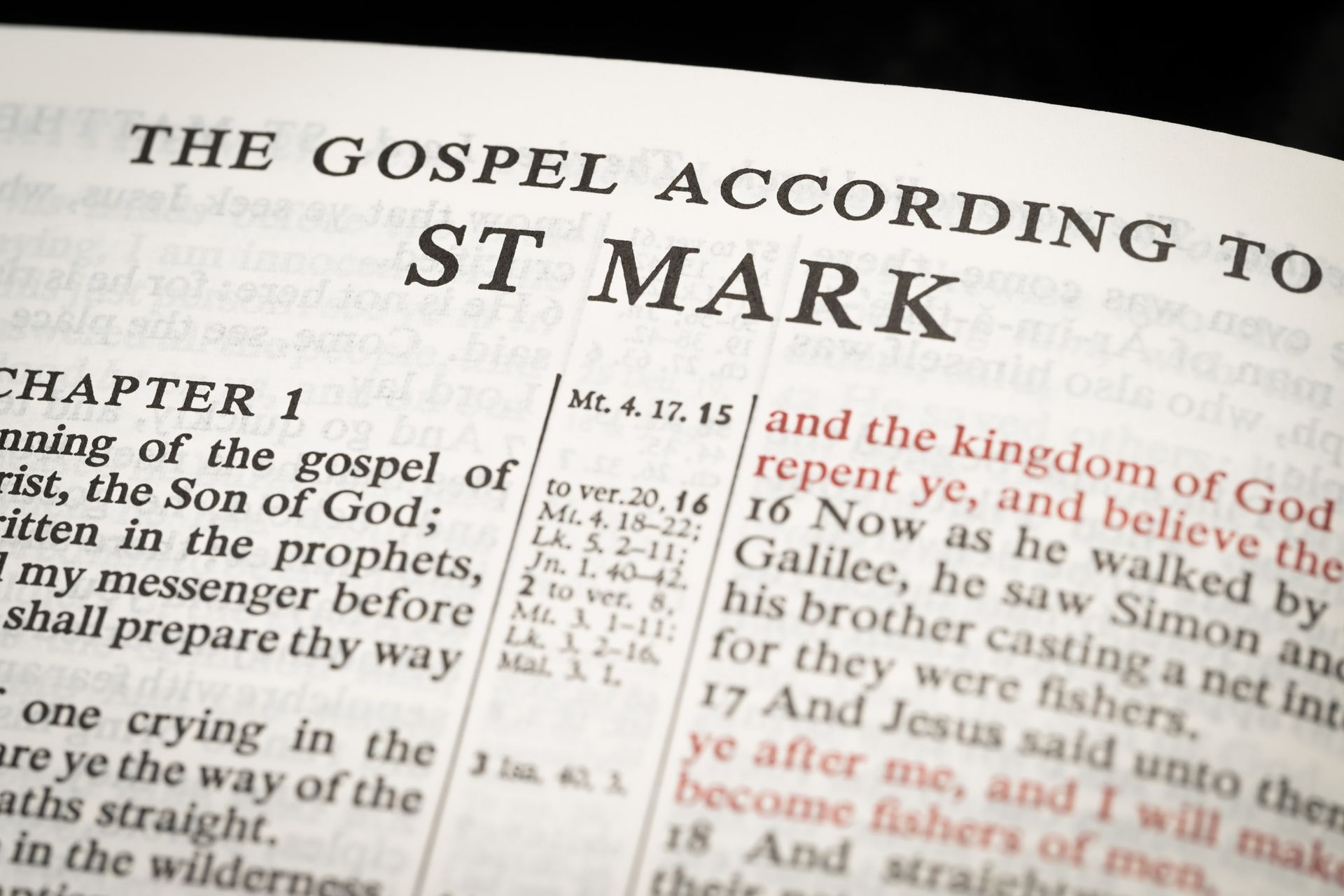 a bible is open to chapter 1 and the gospel according to st mark