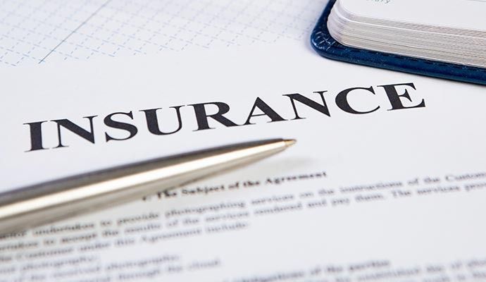 Close-up of an insurance document with the word