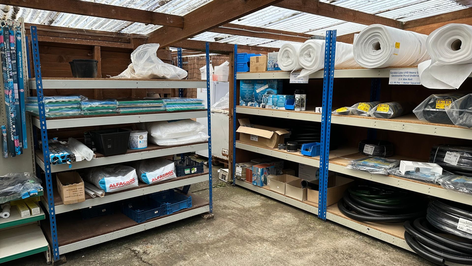 A warehouse filled with shelves filled with lots of items.