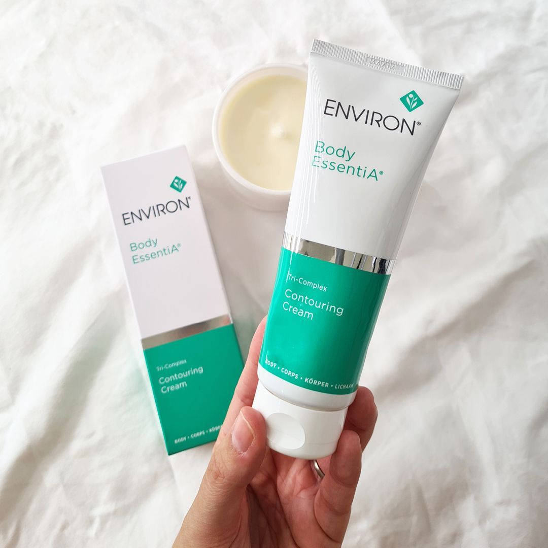 A person is holding a tube of environ body essentials cream — Skin Care Centre of Cairns In Cairns City, QLD
