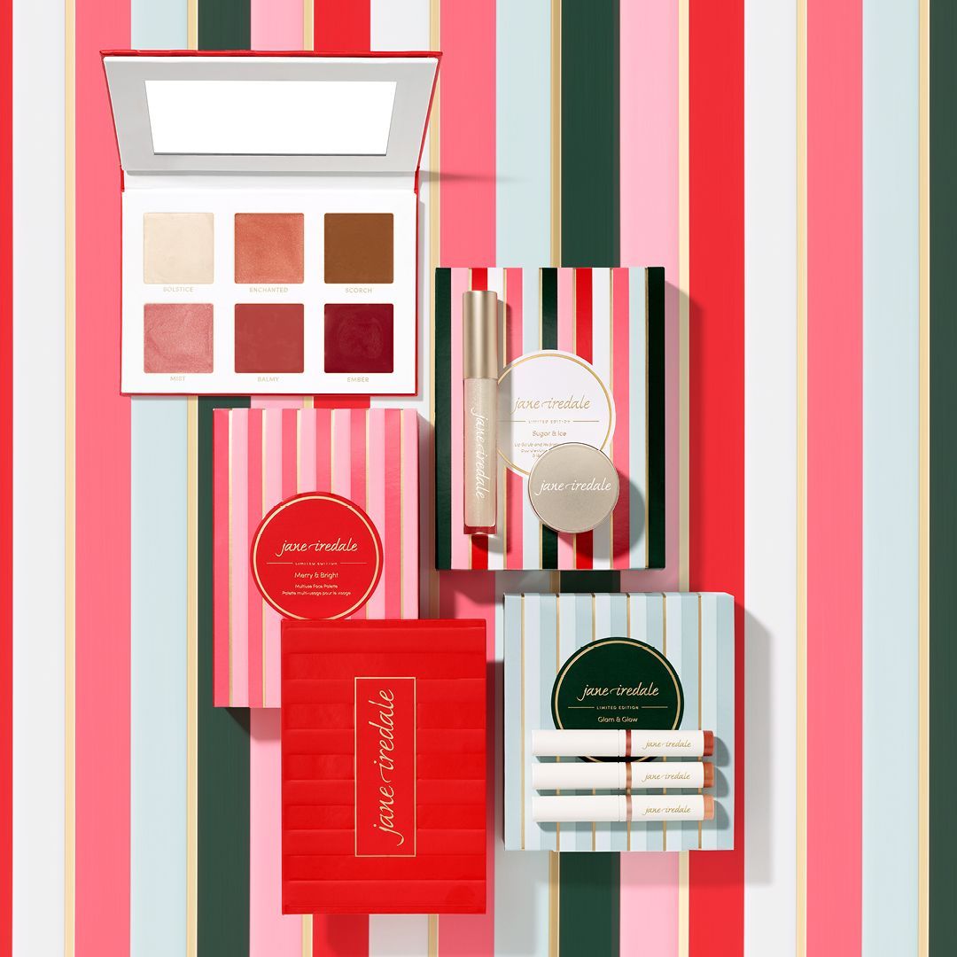 A variety of makeup products are sitting on top of each other on a striped background. — Skin Care Centre of Cairns In Cairns City, QLD