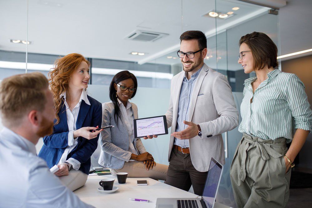 A group of business people are having a meeting in an office.
