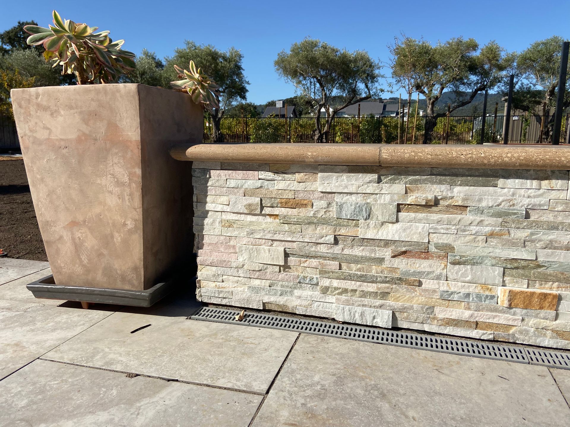 Retaining walls with a large concrete planter by Turfworks Inc. Best Paver & Landscape Contractor in Vacaville, CA