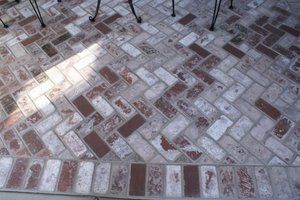 Brick patio in zigzag pattern with a mix of red and light-toned bricks by Turfworks Inc. A paver contractor in Vacaville, CA.