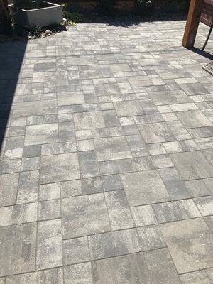 Gray paver patio with a multi-size block pattern, sleek and modern look. Installed by a  paver contractor in Vacaville, CA.