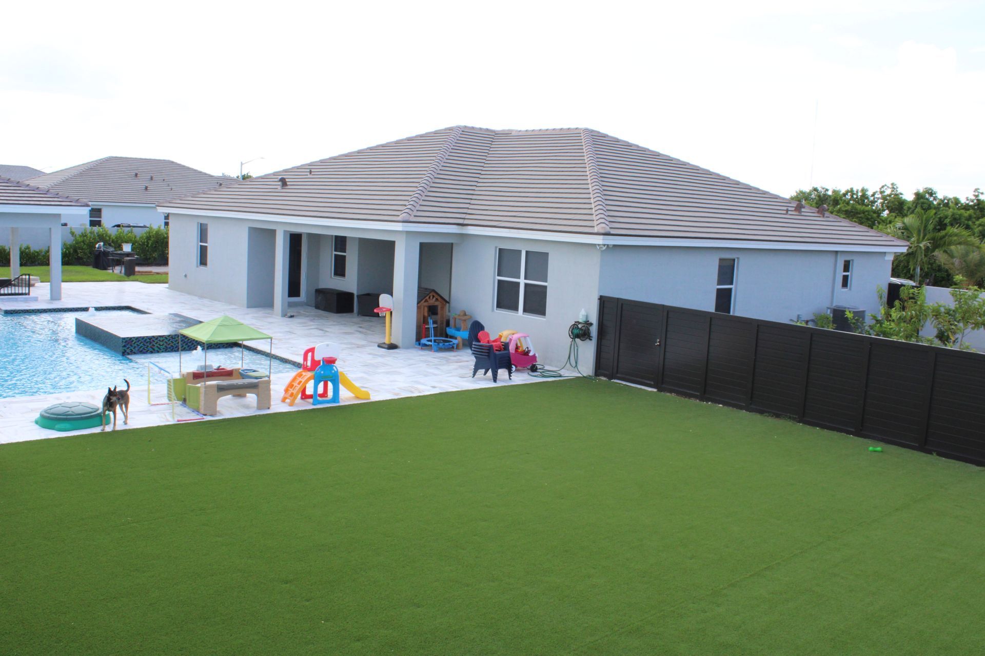 A large house with a swimming pool in the backyard.