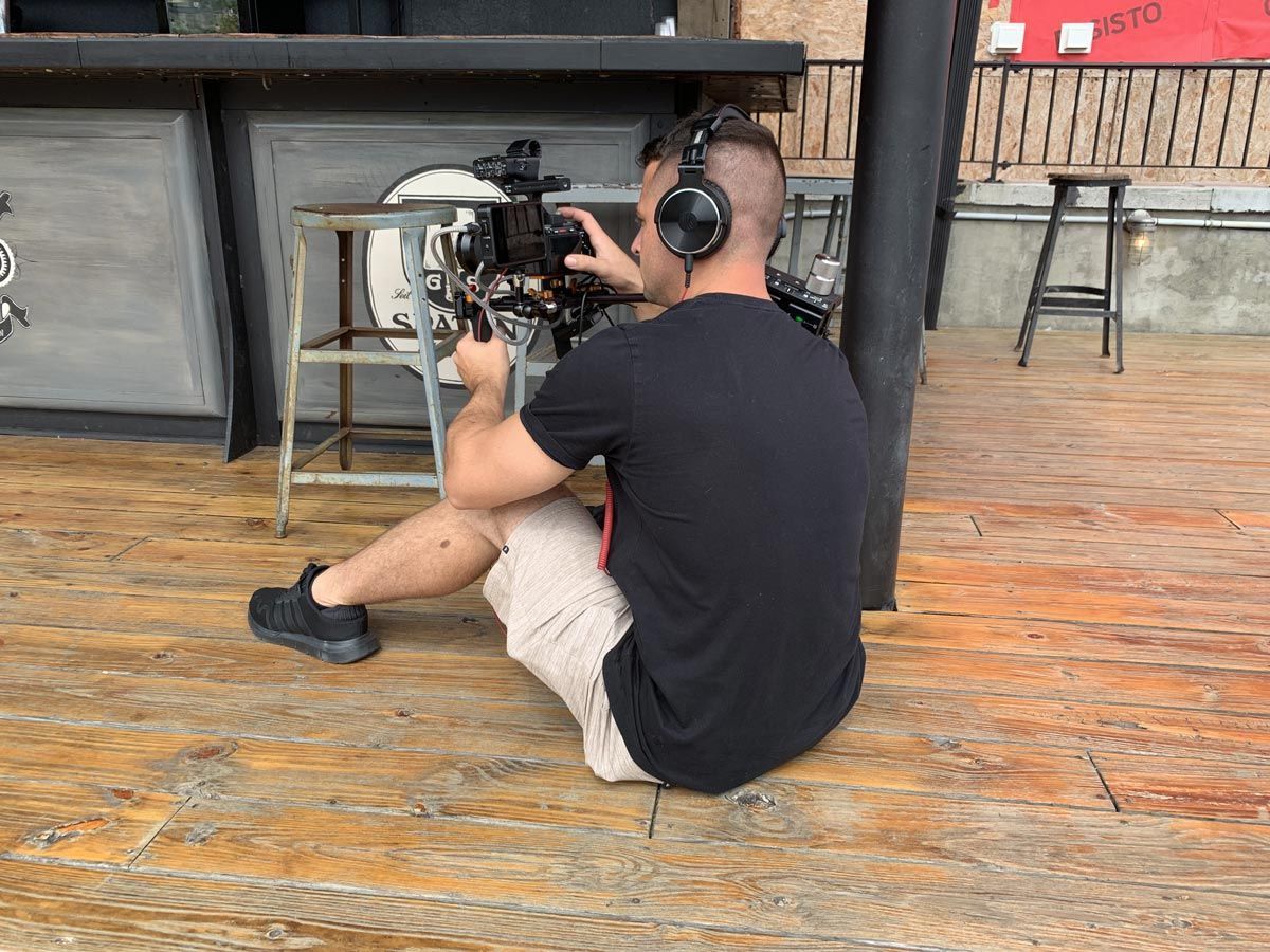 A person sitting on the floor with a camera on his head — Brick, NJ — NJ Filmmaker