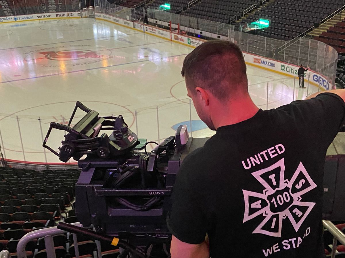 A person using a camera in a stadium — Brick, NJ — NJ Filmmaker