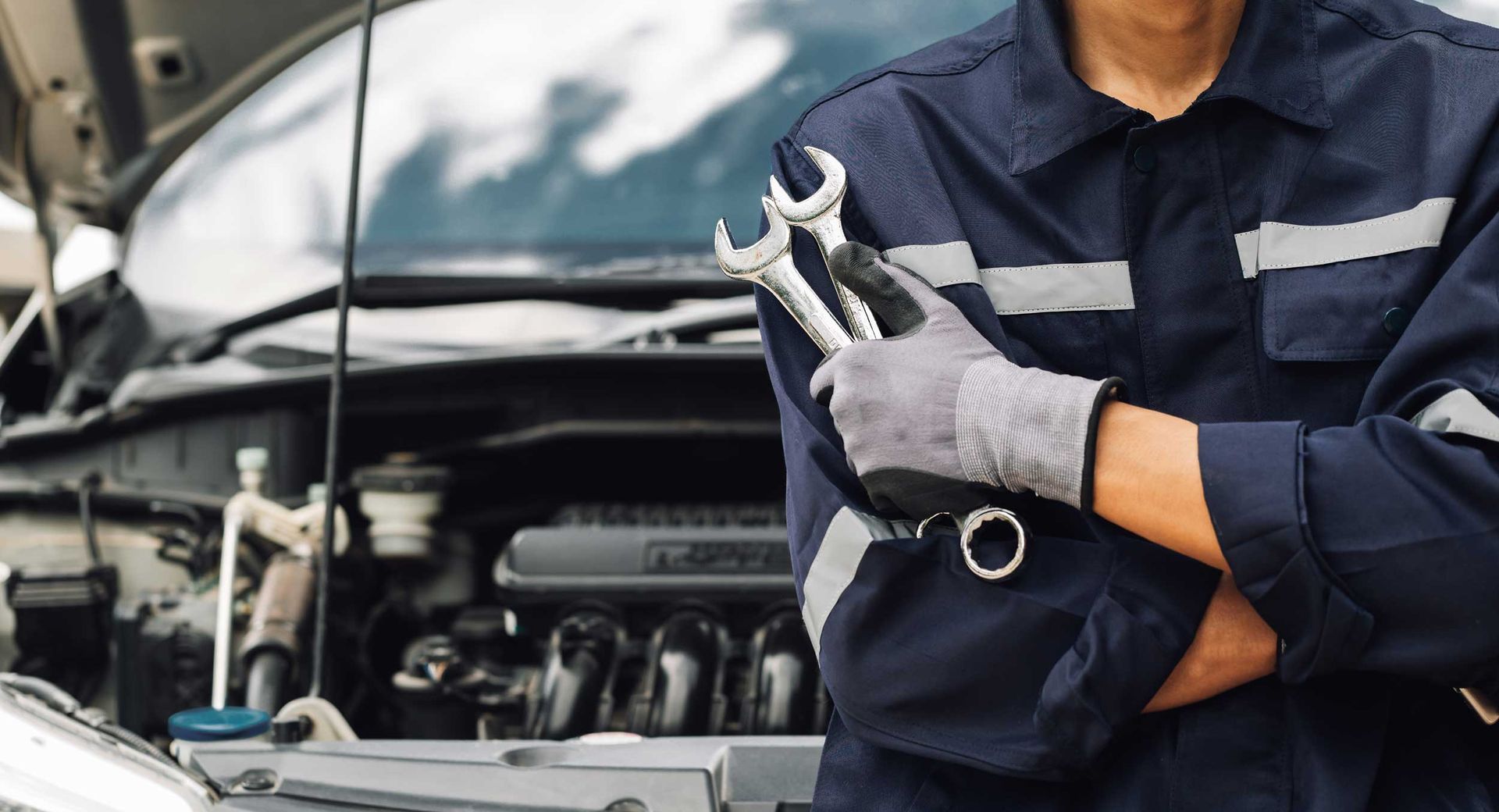 Hand of car mechanic with wrench