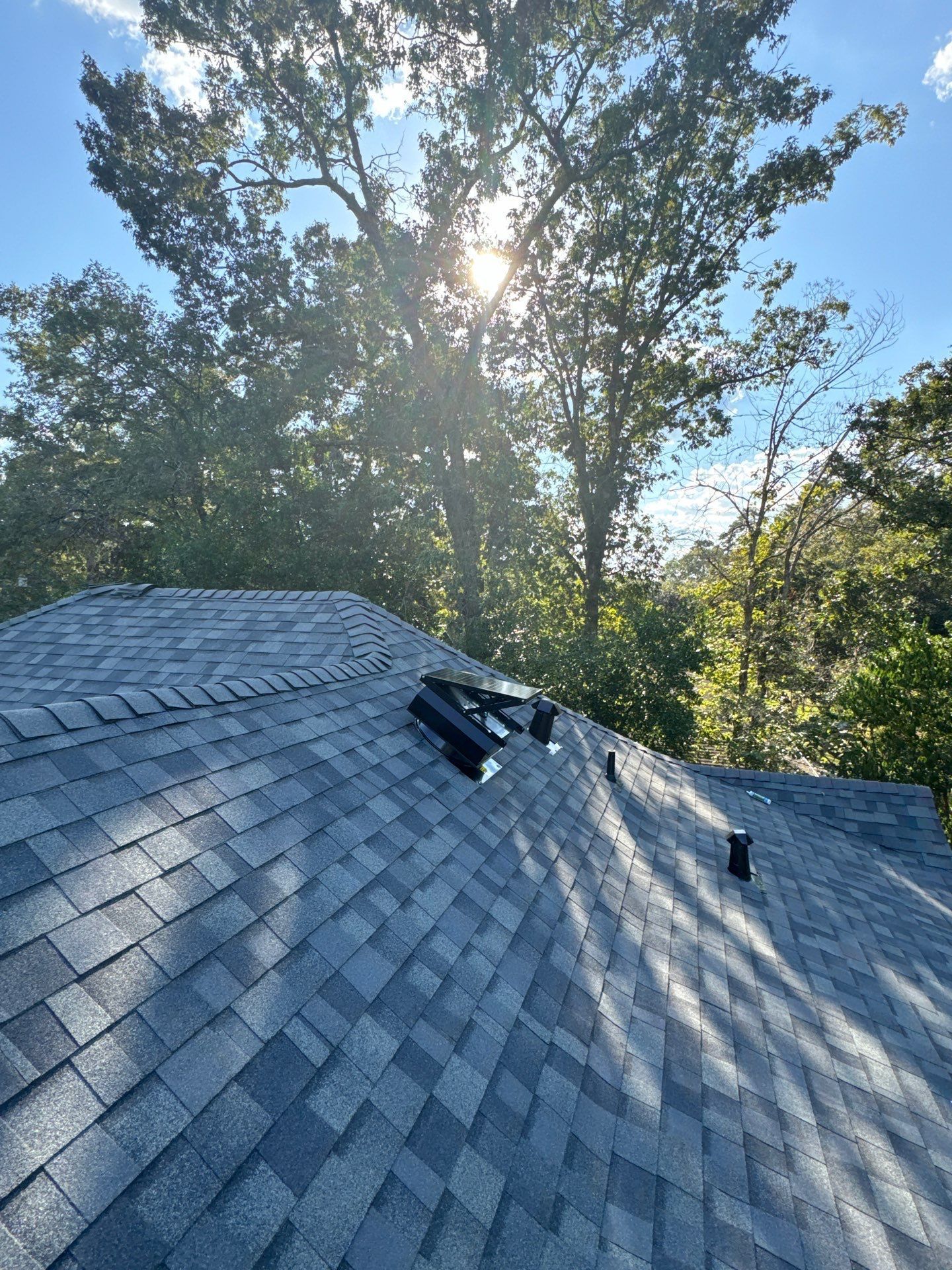 Hiring a roofer in Conroe for a roof replacement.  Rizen Roofing completed a roof replacement