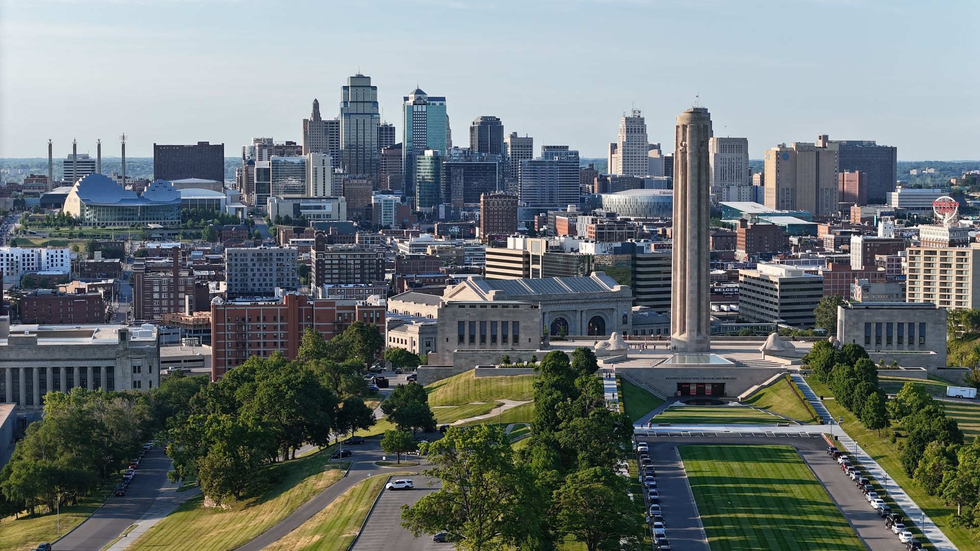 The sun is setting over the ocean and the waves are crashing on the beach.