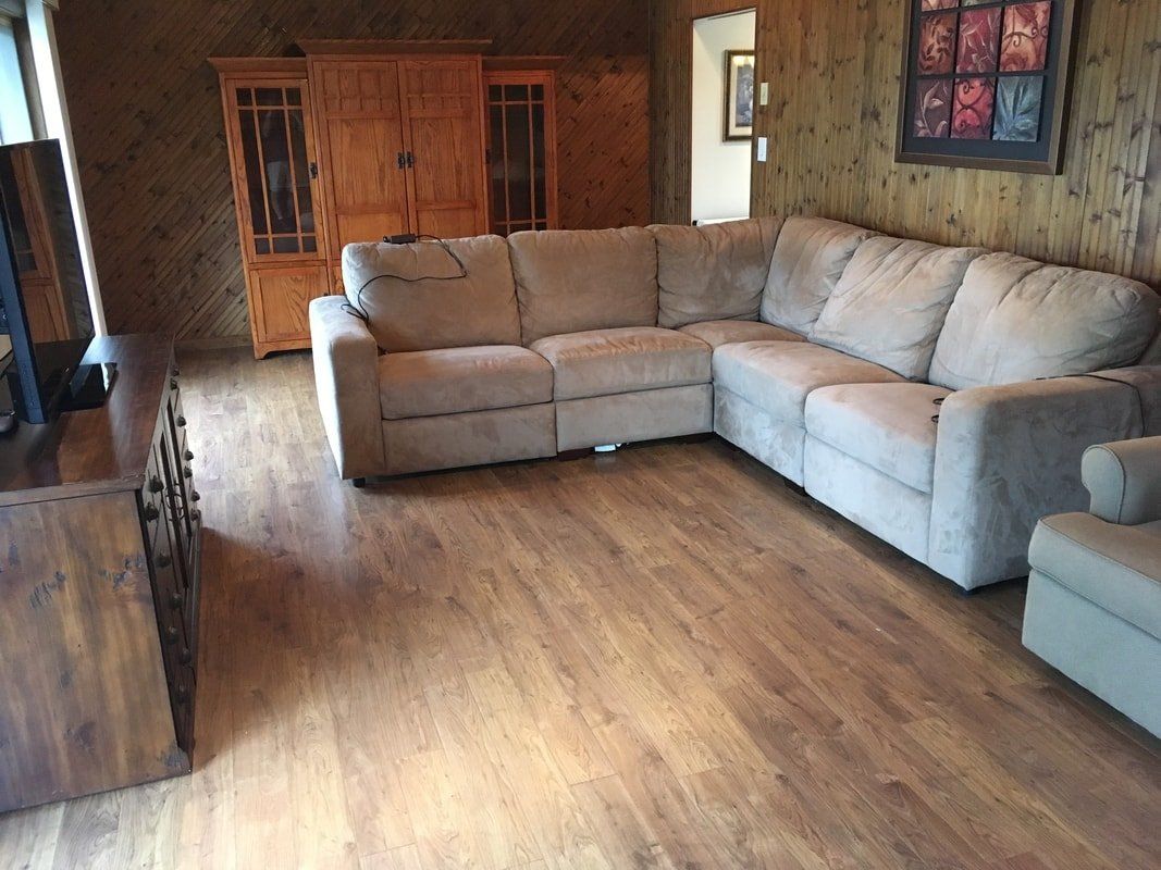 Couch in Living Room — Laminate Flooring in Hamburg, NY