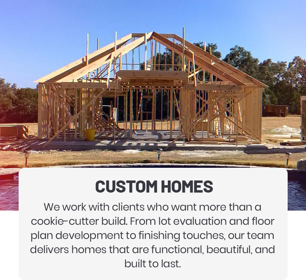 Framed wooden structure of a house under construction with text "CUSTOM HOMES".