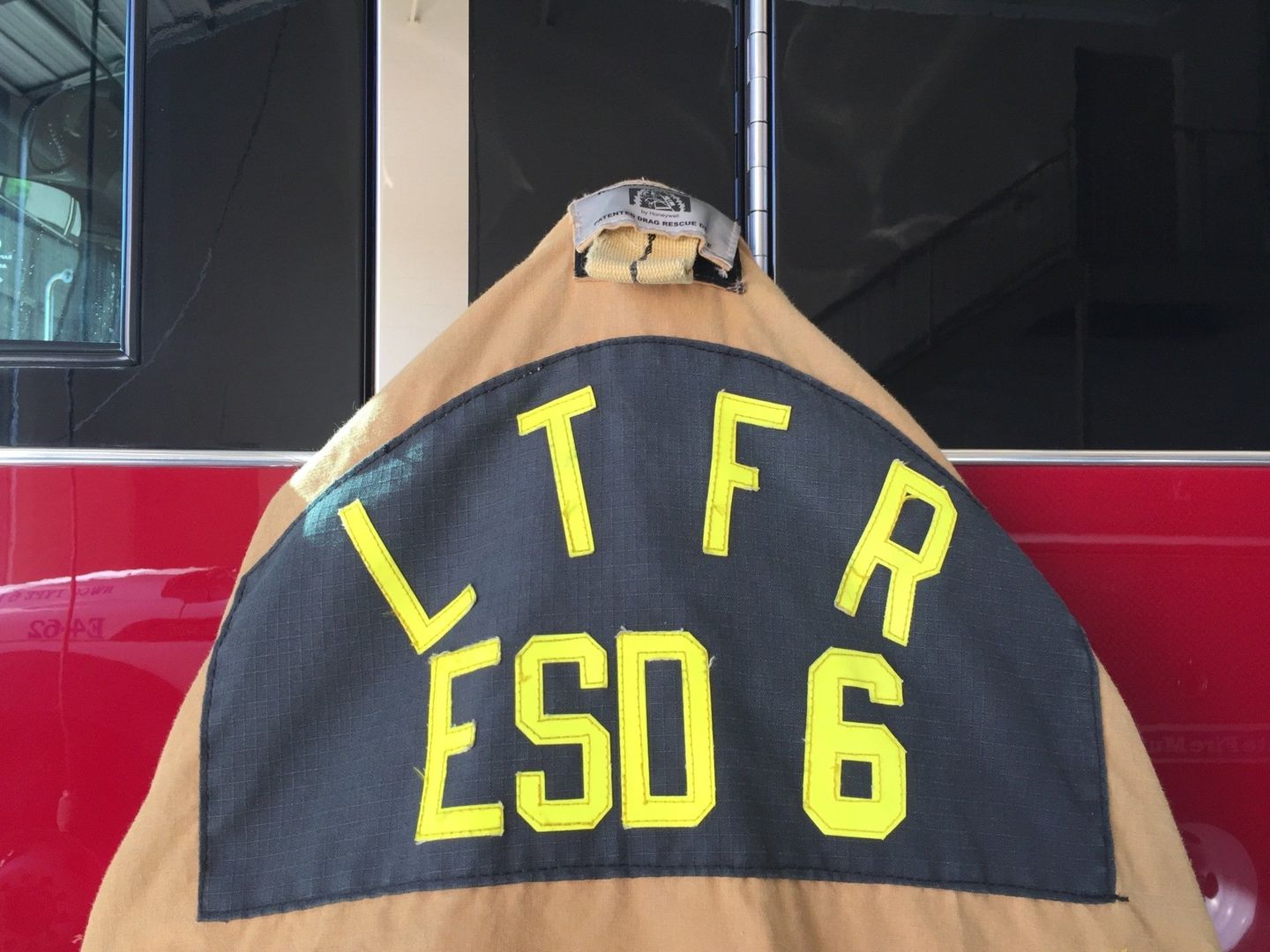 The back of a firefighter 's uniform says ltfr esd 6