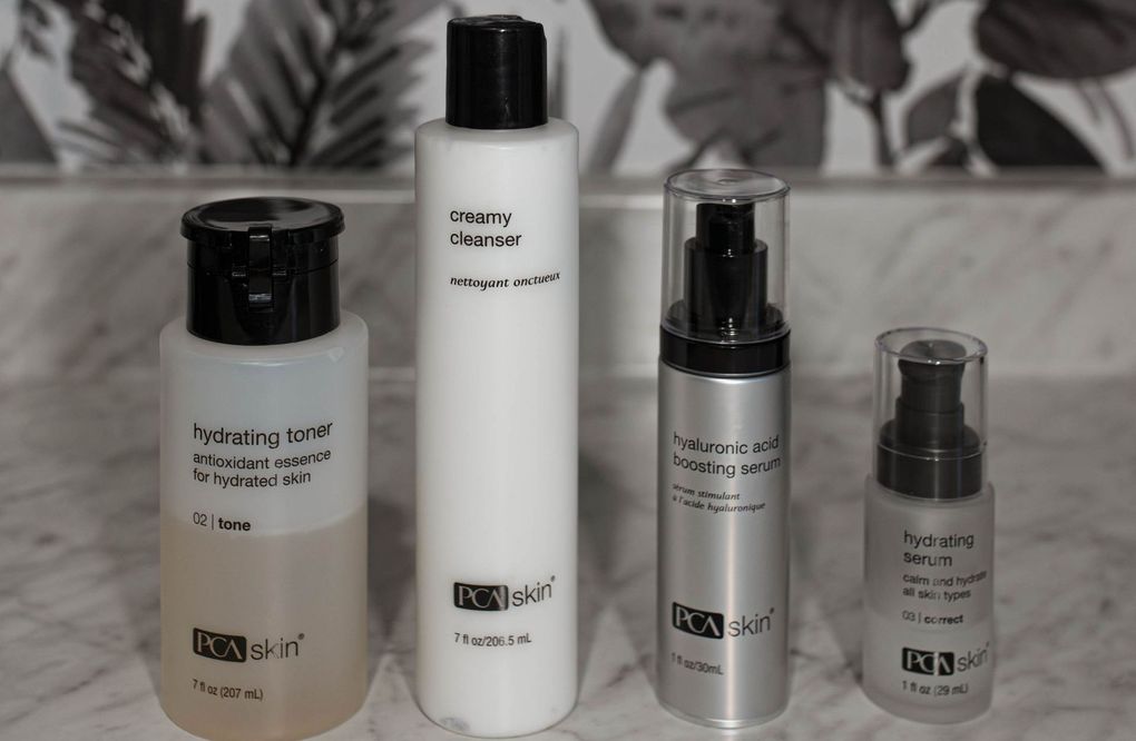 Five bottles of pca skin products are lined up on a counter