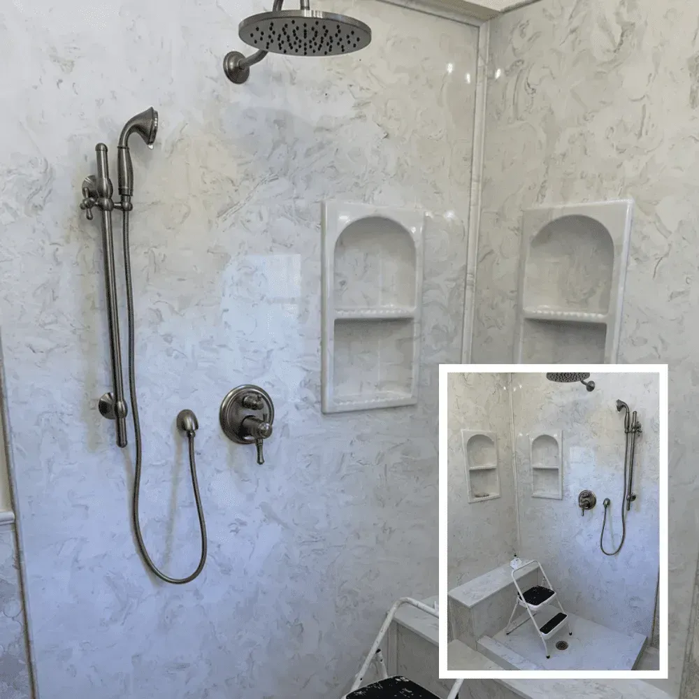 Shower with white marble-like walls, two built-in shelves, a handheld shower, and a rain showerhead by Syn-Mar