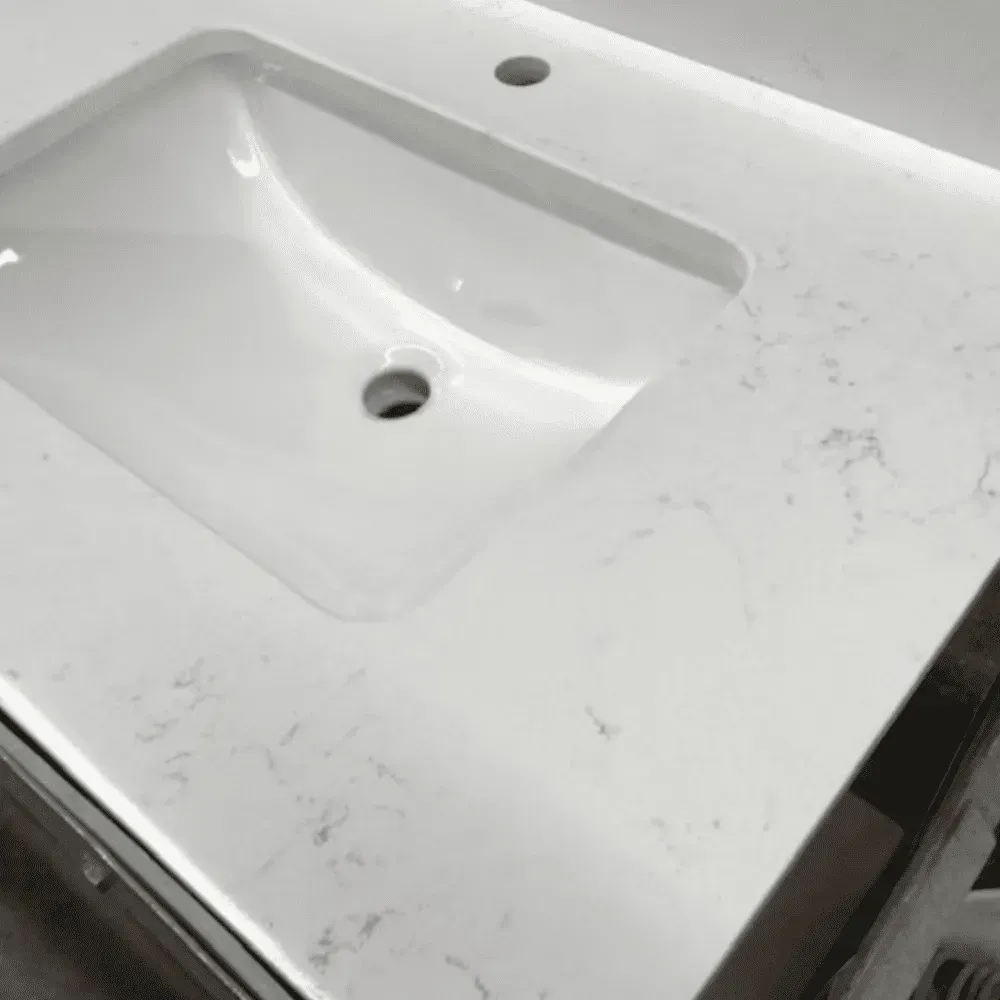 White bathroom sink and countertop, veined stone pattern, with faucet holes by Syn-Mar