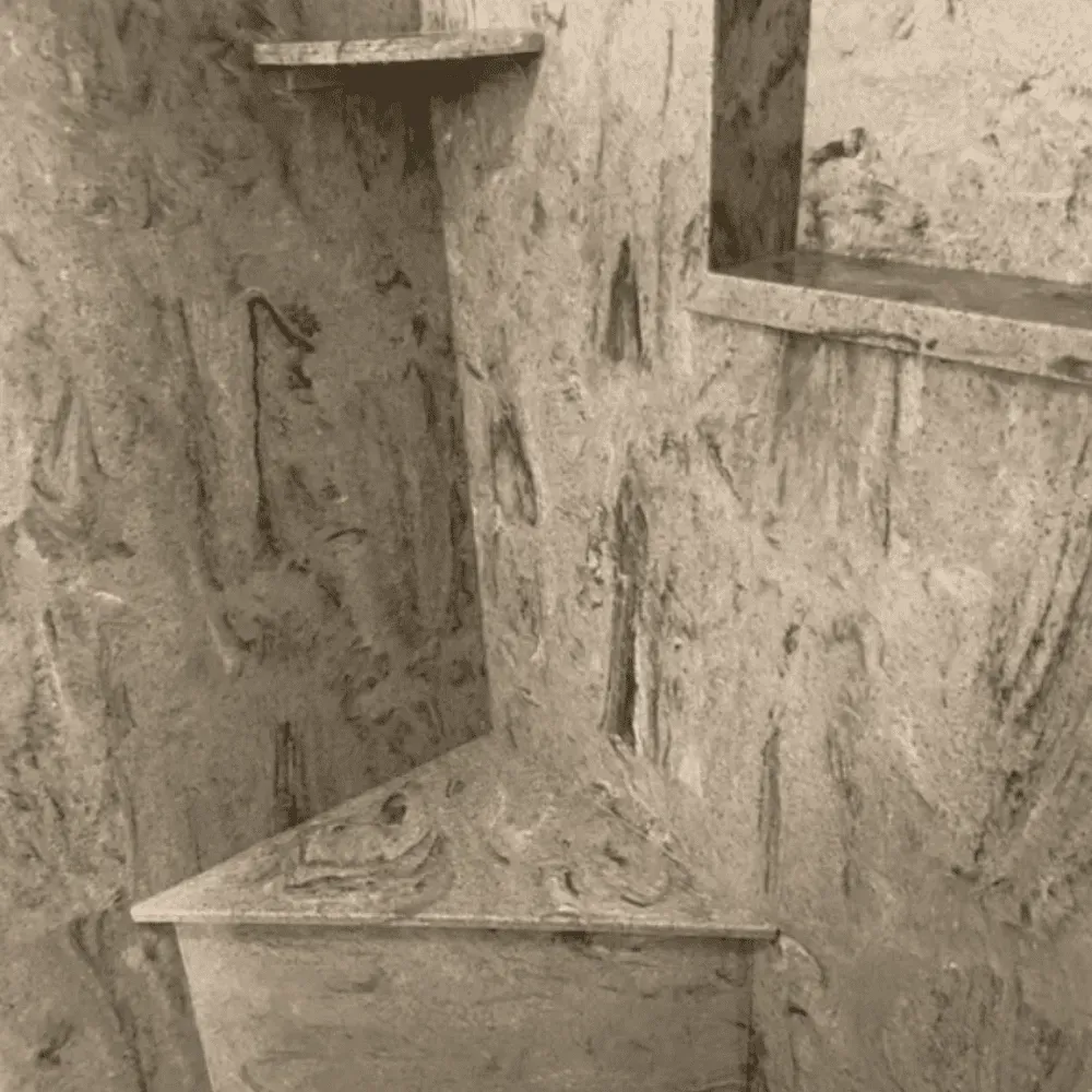 Stone-like wall with built-in shelves. One shelf at an angle, sepia tone by Syn-Mar