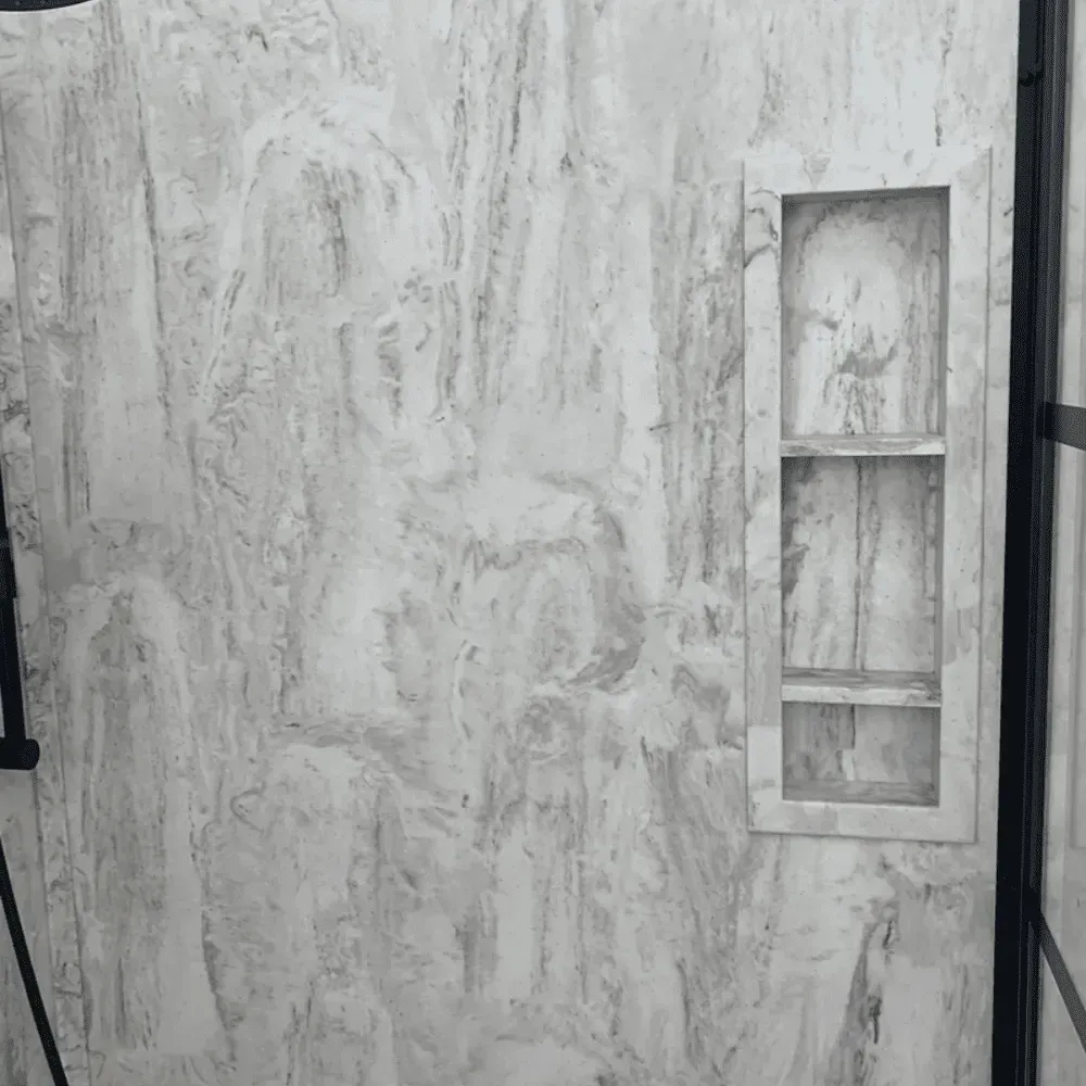 Stone wall with built-in, three-shelf niche. Light and dark gray veining by Syn-Mar