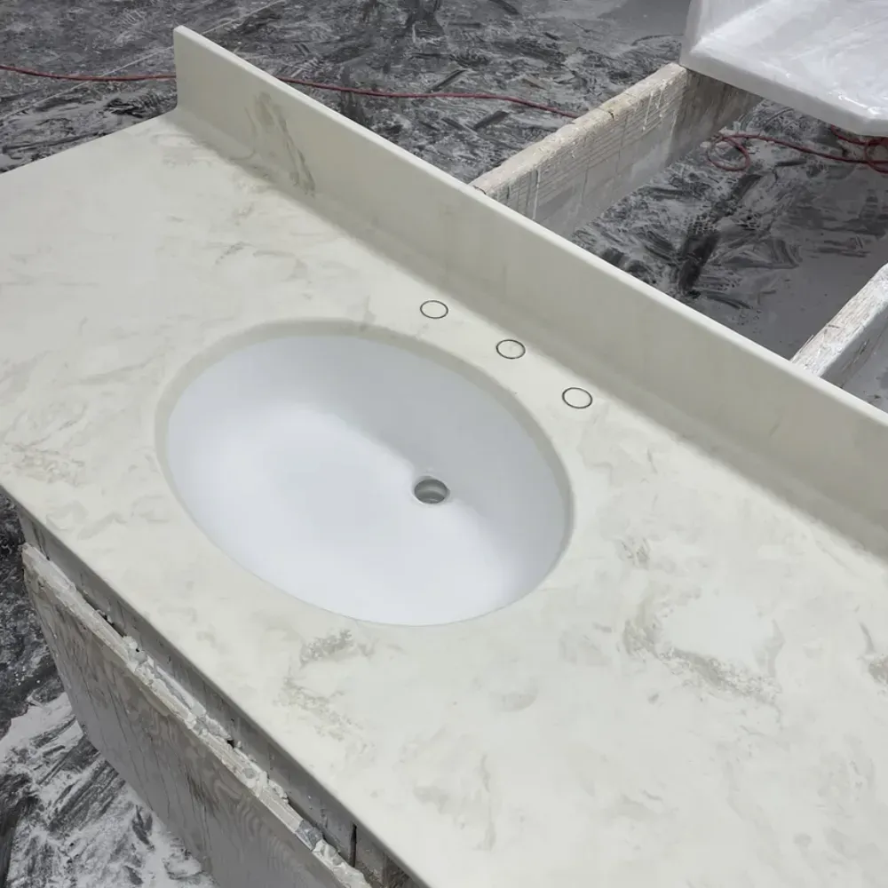 White quartz countertop with oval sink and faucet holes by Syn-Mar