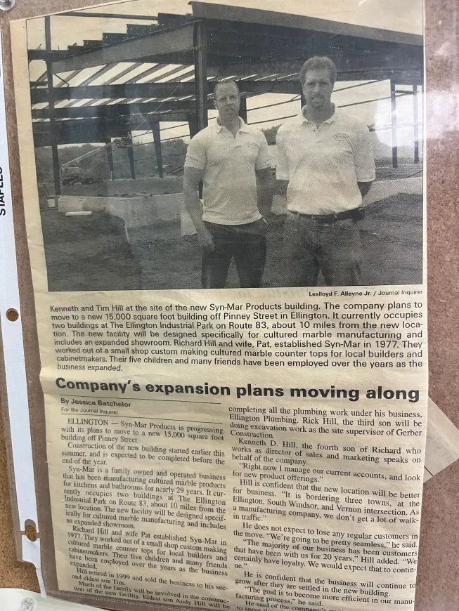 Ken (left) and Tim Hill (right) in a newspaper article about Syn-Mar’s new facility.