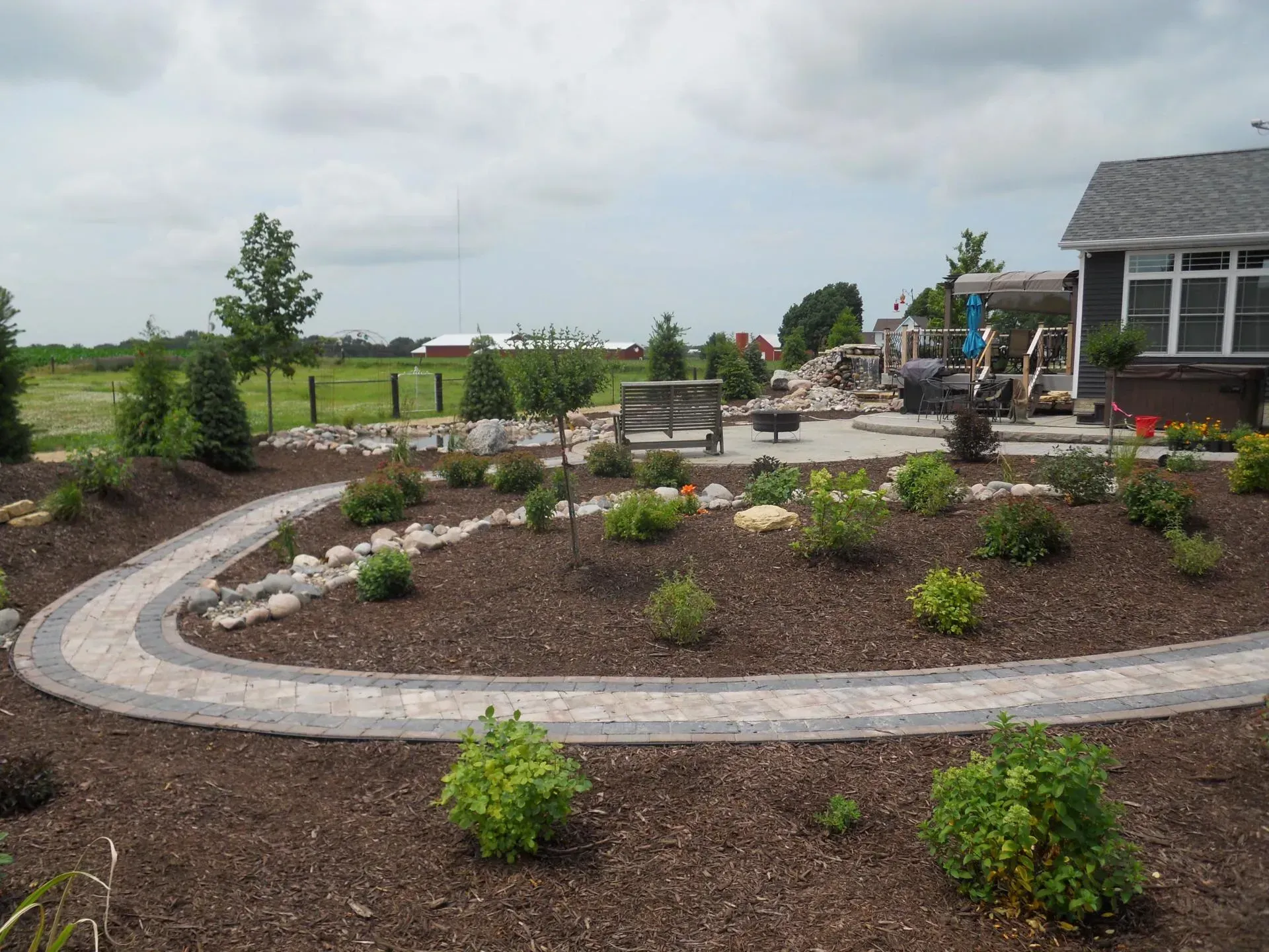 Paver walkway with water fall- Orion, IL- C & J Landscaping