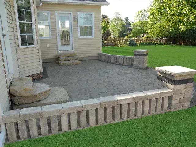 Paver patio with seater wall- Davenport, IA- C & J Landscaping