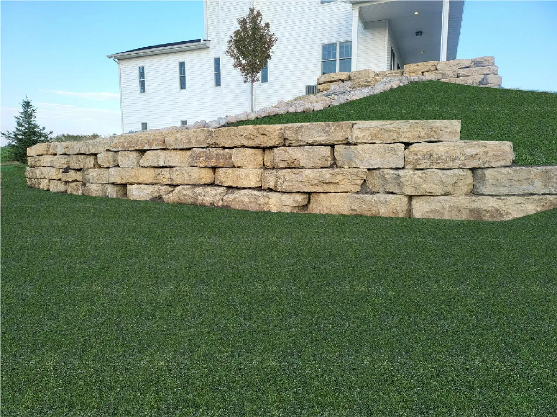 A Retaining Wall Near House - Orion, IL - C & J Landscaping