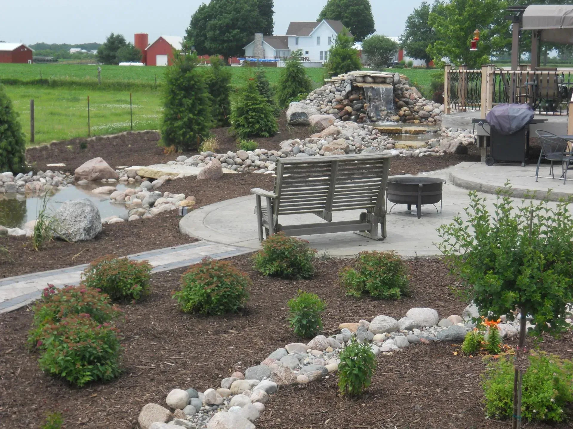 Water fall with paver patio- Orion, IL- C & J Landscaping