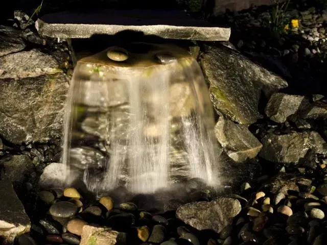 Water fall at night- Davenport, IA- C & J Landscaping