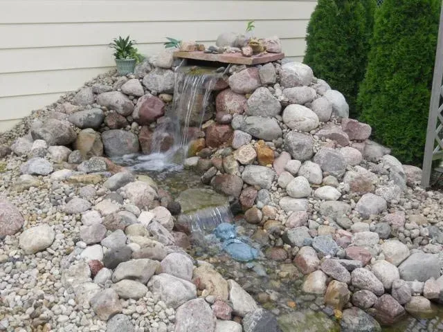 Water fall with stream- Moline, IL- C & J Landscaping