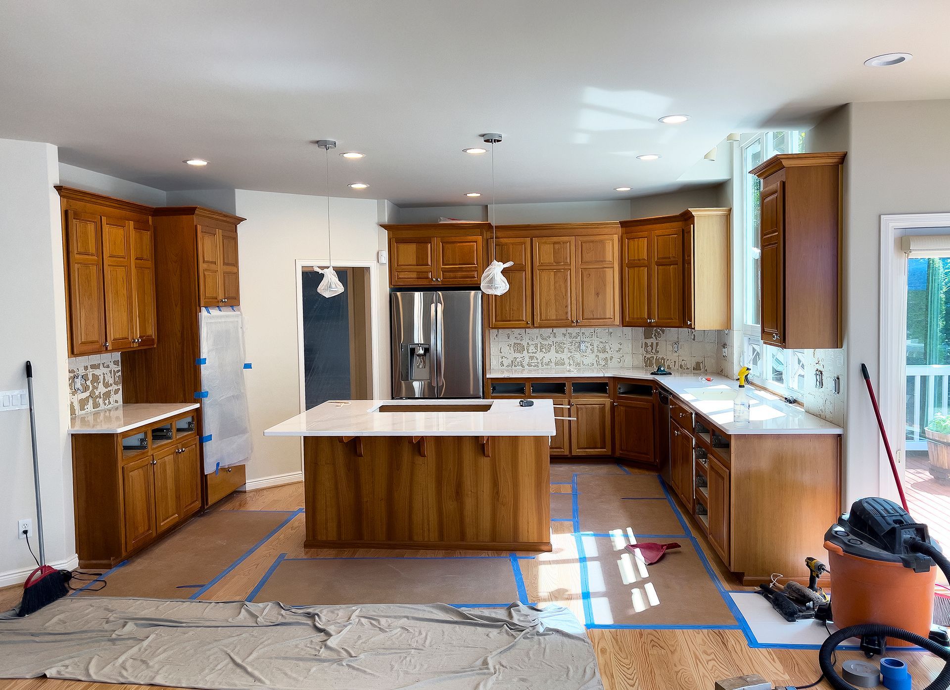 a kitchen that is being remodeled with wood cabinets