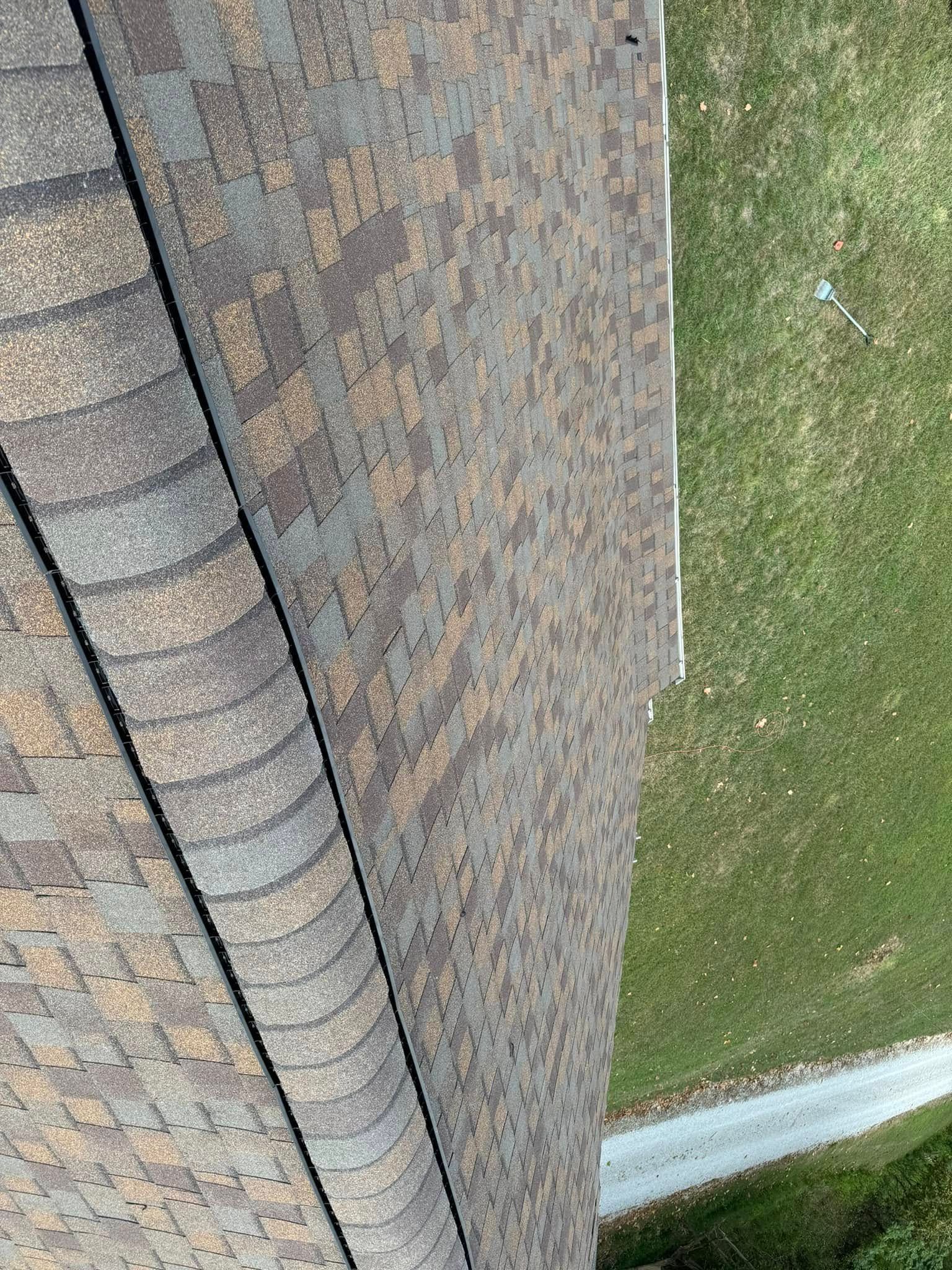 A close up of a roof with shingles on it.