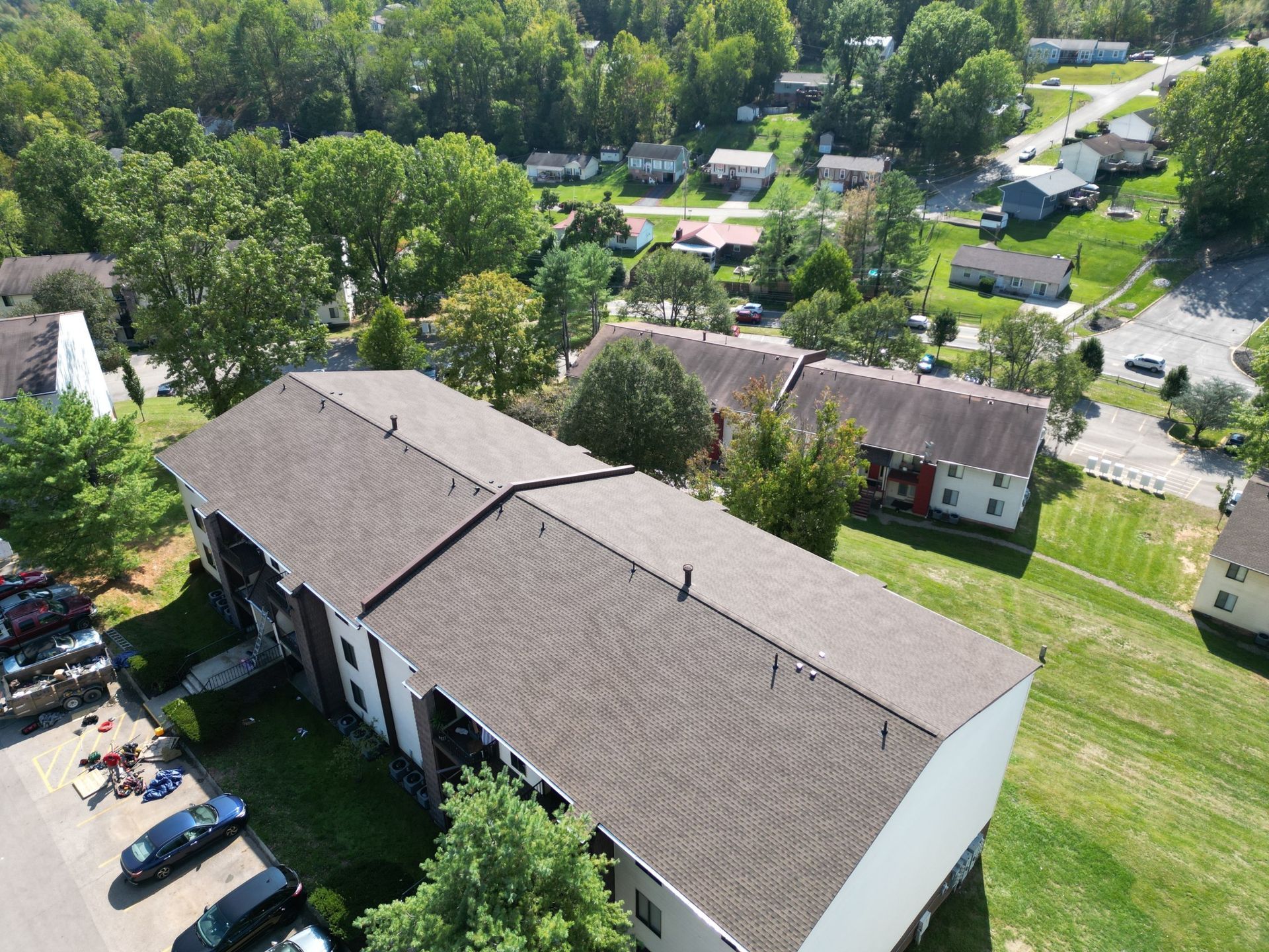 An aerial view of a residential area with houses and trees