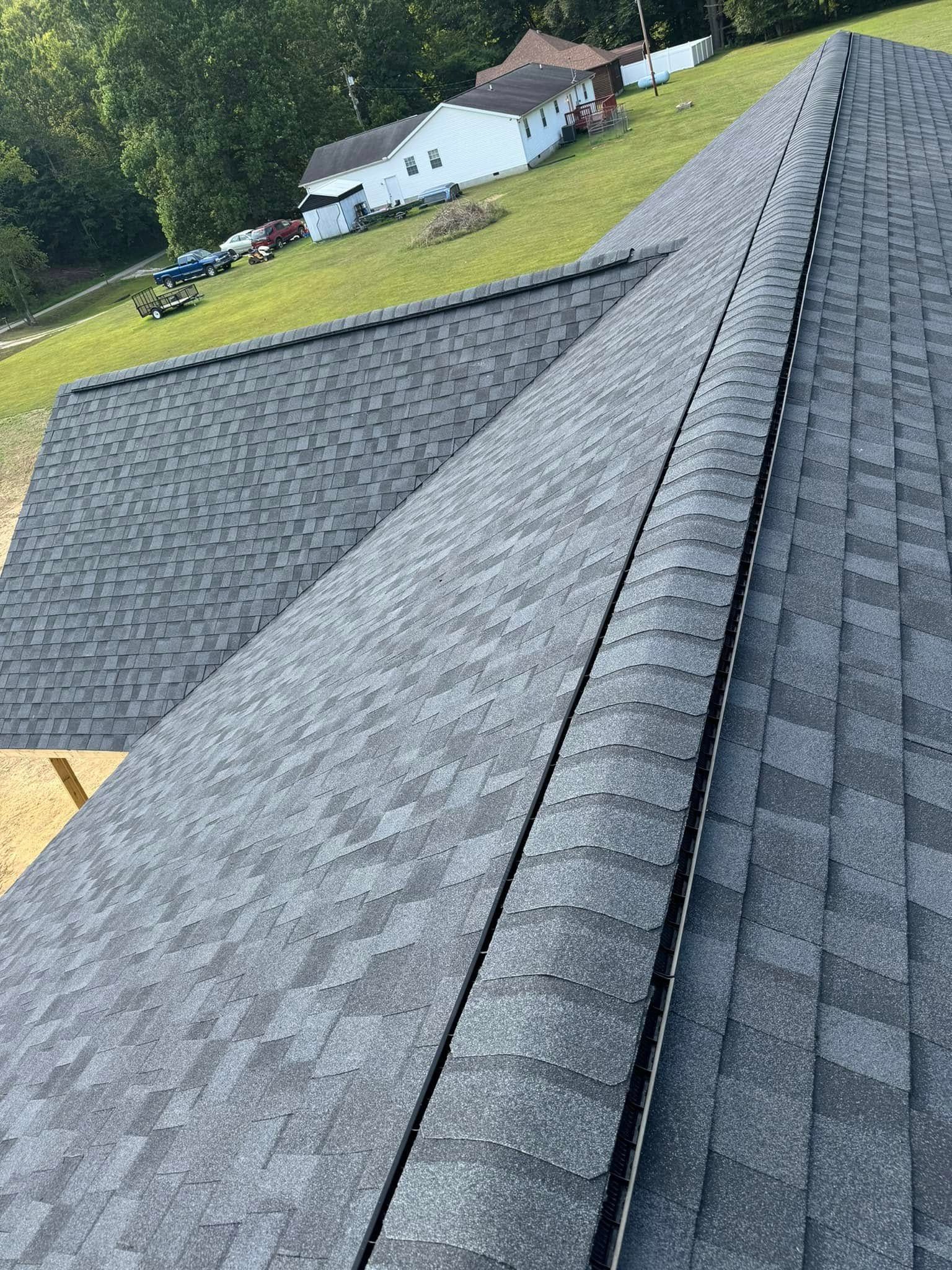 A close up of a roof with a lot of shingles on it.