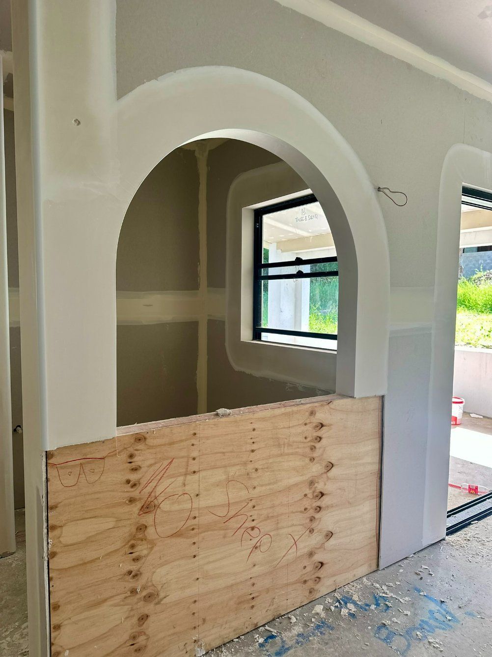 A Room With a Window and a Wooden Wall — Hams Plastering in Airlie Beach, QLD