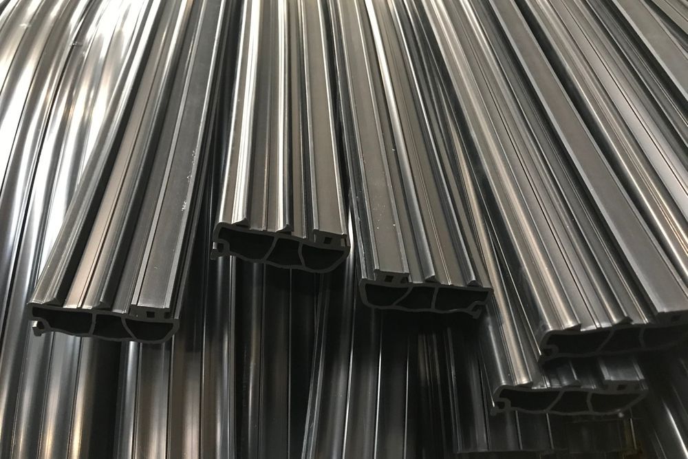 A Bunch Of Metal Pipes Are Stacked On Top Of Each Other — Ram Star Plastics In Winnellie, NT