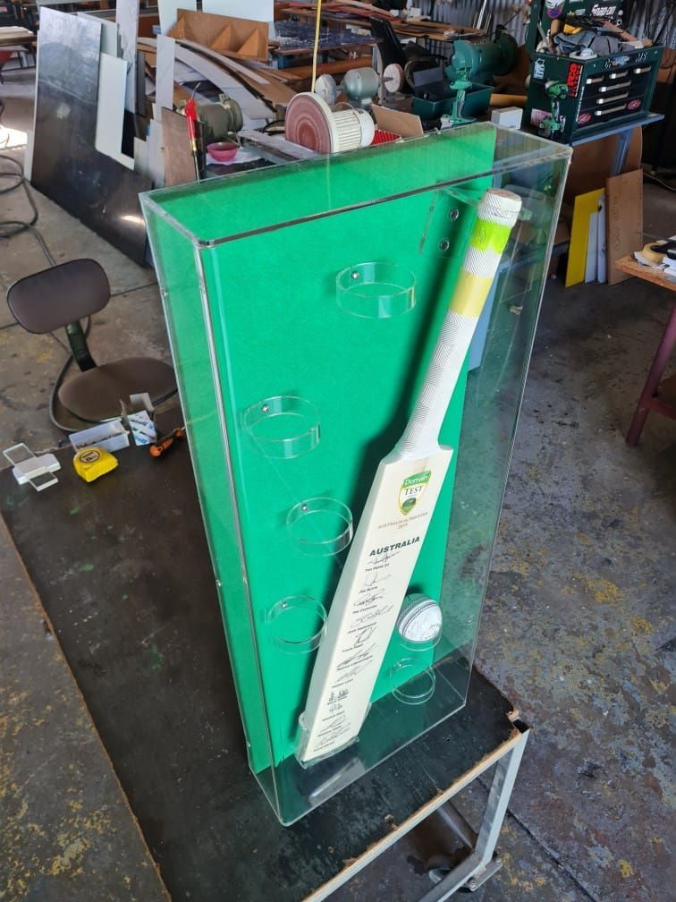 A Cricket Bat Is Displayed In A Clear Acrylic Case — Ram Star Plastics In Winnellie, NT