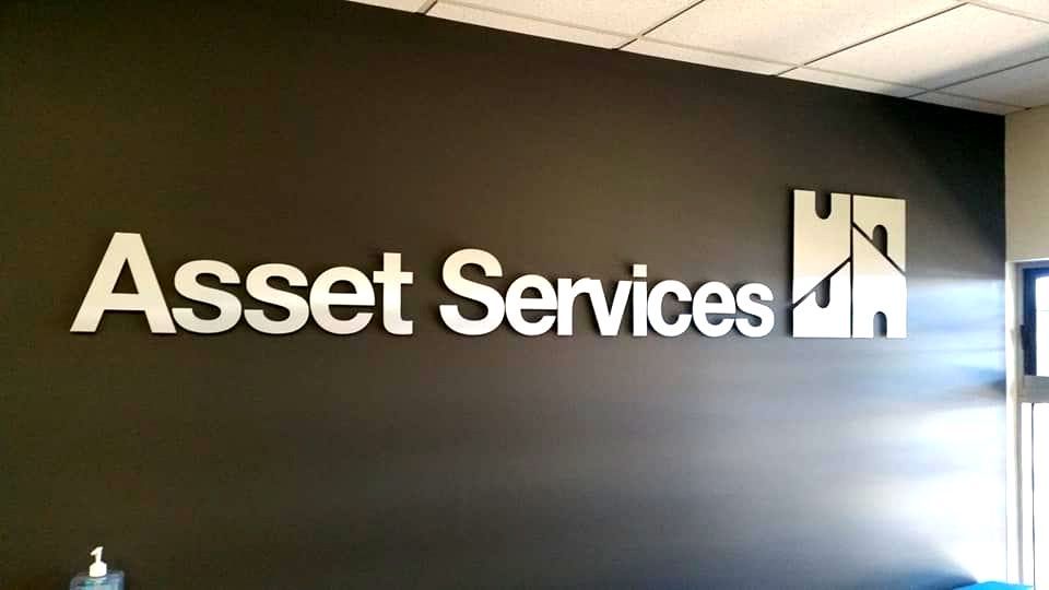 A Black Wall With The Word Asset Services On It — Ram Star Plastics In Winnellie, NT